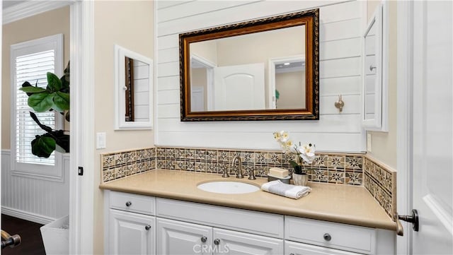 38 Upperbend, Irvine, CA 92618 - bathroom featuring backsplash, vanity, and a wainscoted wall