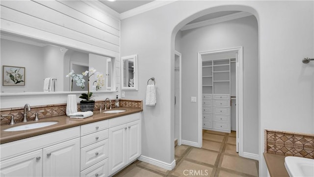 38 Upperbend, Irvine, CA 92618 - full bath with a tub, crown molding, tile patterned flooring, double vanity, and a walk in closet