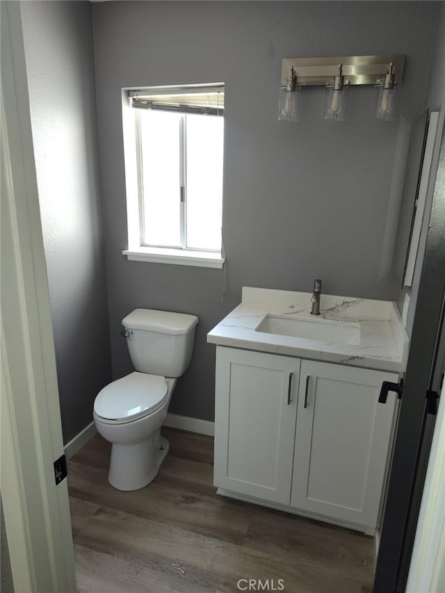 26702 Via Linares, Mission Viejo, CA 92691 - bathroom with vanity, baseboards, wood finished floors, and toilet
