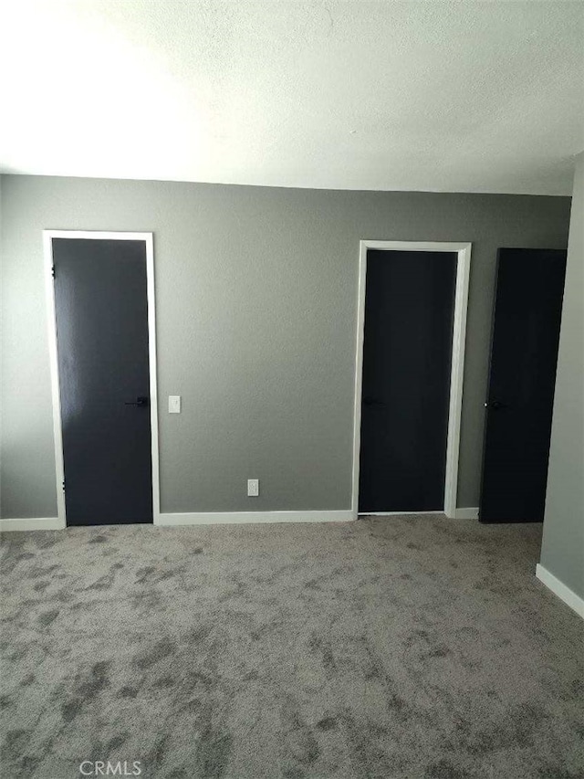 26702 Via Linares, Mission Viejo, CA 92691 - empty room featuring carpet, baseboards, and a textured ceiling