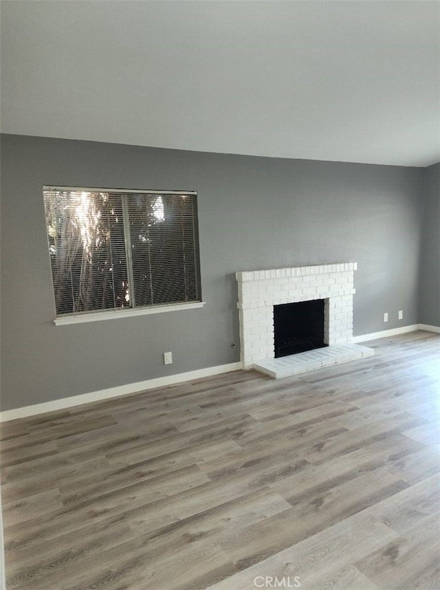 26702 Via Linares, Mission Viejo, CA 92691 - unfurnished living room with wood finished floors, baseboards, and a fireplace