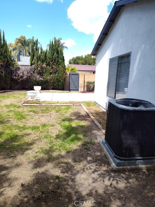26702 Via Linares, Mission Viejo, CA 92691 - view of yard featuring central AC and a gate