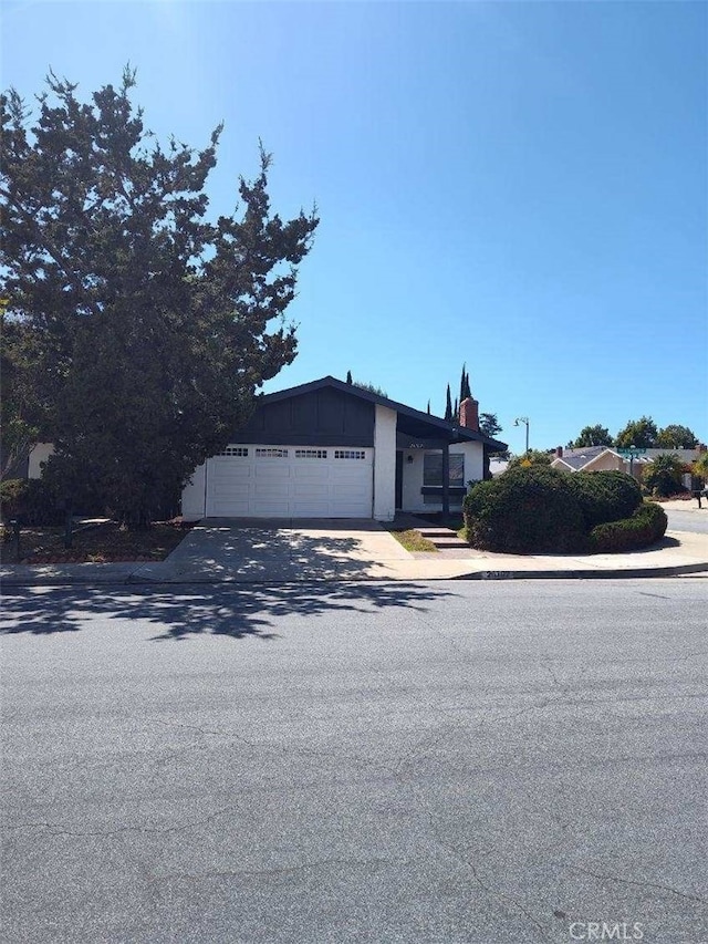 26702 Via Linares, Mission Viejo, CA 92691 - view of front of house featuring an attached garage and driveway