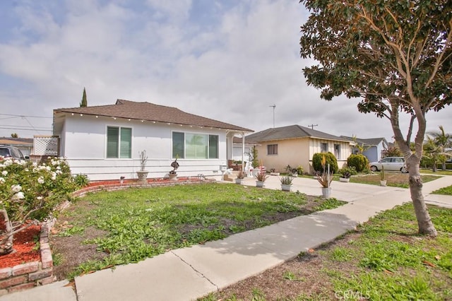 15132 Kornblum Ave, Lawndale, CA 90260 - view of front facade featuring a front lawn, stucco siding, and a shingled roof