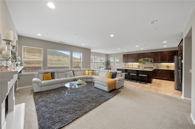 35712 Ginger Tree Dr, Winchester, CA 92596 - living room featuring light carpet, recessed lighting, and baseboards