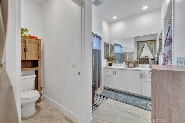 full bath with marble finish flooring, toilet, vanity, baseboards, and recessed lighting