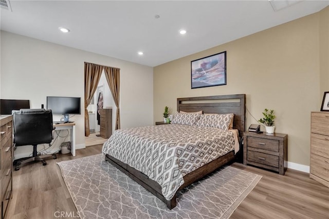 bedroom featuring baseboards, light wood-style flooring, a desk, and recessed lighting