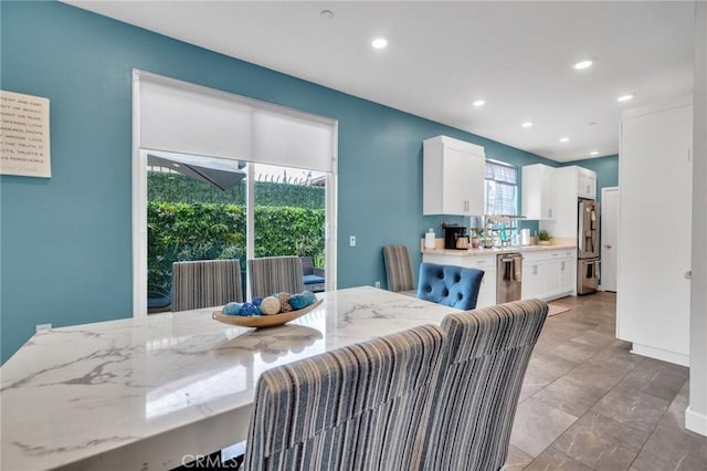 dining area featuring recessed lighting