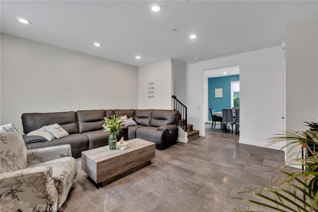 living area featuring recessed lighting, stairway, and baseboards