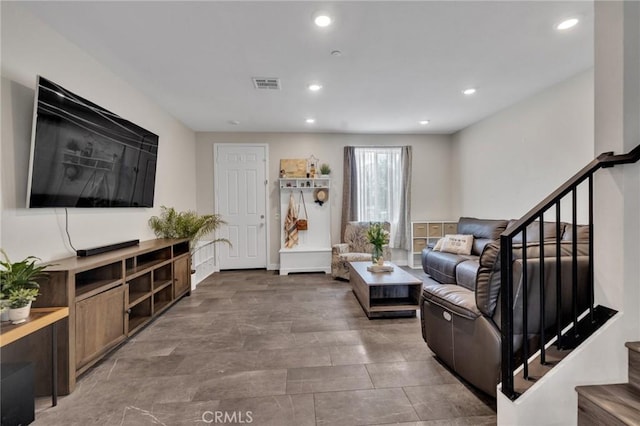 living room with stairway and recessed lighting