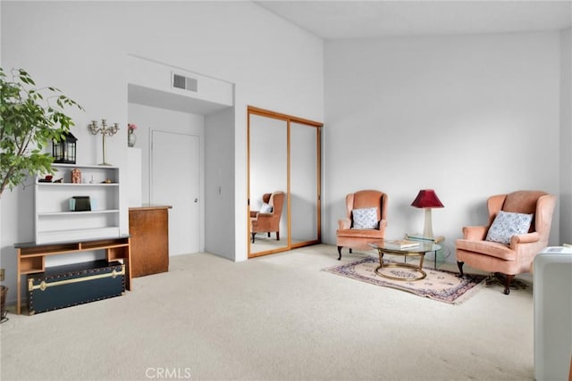 sitting room featuring carpet