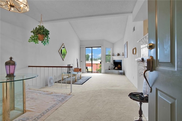 6323 Reseda Blvd Unit 44, Tarzana, CA 91335 - living area with carpet, a lit fireplace, a textured ceiling, a chandelier, and lofted ceiling