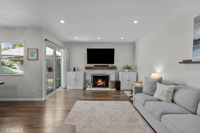 3821 W 183rd St, Torrance, CA 90504 - living room featuring wood finished floors, a fireplace, recessed lighting, baseboards, and radiator heating unit