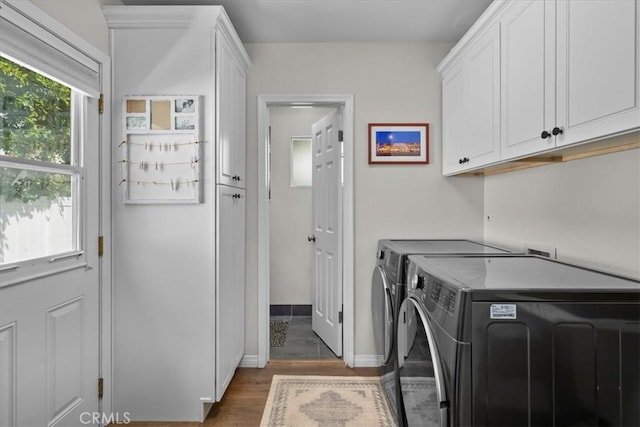 3821 W 183rd St, Torrance, CA 90504 - clothes washing area featuring washing machine and dryer, cabinet space, wood finished floors, and baseboards