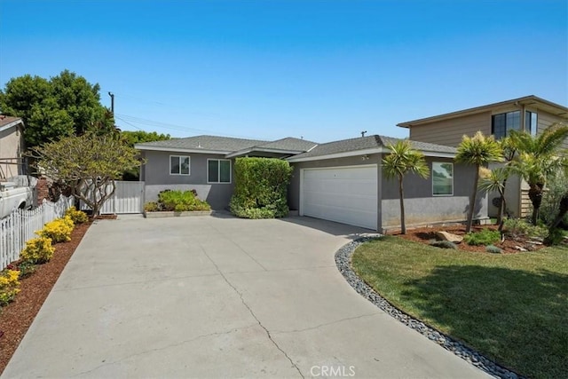 3821 W 183rd St, Torrance, CA 90504 - view of front of house featuring driveway, an attached garage, and stucco siding