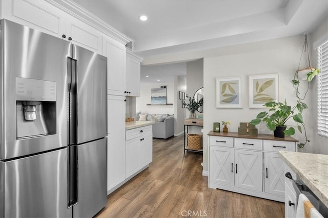 3821 W 183rd St, Torrance, CA 90504 - kitchen featuring stainless steel fridge, light wood-style flooring, white cabinetry, recessed lighting, and light stone countertops