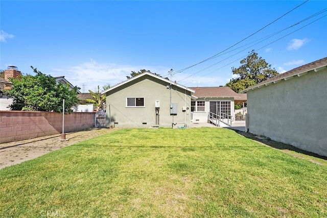 rear view of property featuring stucco siding