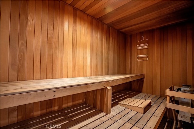 43473 30th St W Unit 4, Lancaster, CA 93536 - relaxing sauna with wooden walls, wood ceiling, and hardwood / wood-style floors