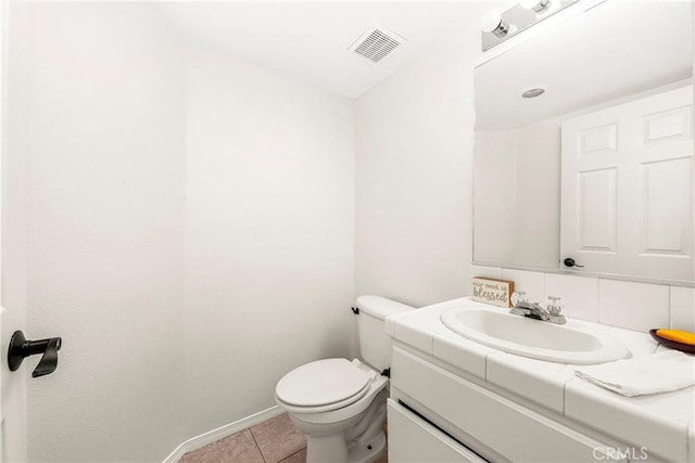 43473 30th St W Unit 4, Lancaster, CA 93536 - half bath featuring tile patterned floors, vanity, toilet, and baseboards