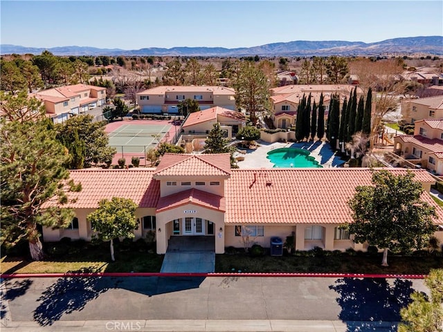 43473 30th St W Unit 4, Lancaster, CA 93536 - aerial view of residential area featuring mountains and a pool area