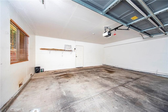 43473 30th St W Unit 4, Lancaster, CA 93536 - garage featuring a garage door opener