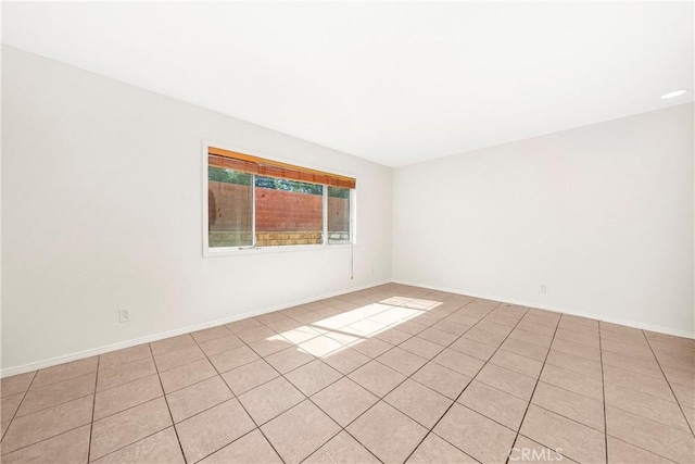 43473 30th St W Unit 4, Lancaster, CA 93536 - unfurnished room with light tile patterned floors and baseboards