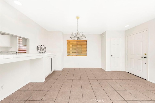 43473 30th St W Unit 4, Lancaster, CA 93536 - unfurnished dining area with a chandelier, light tile patterned flooring, baseboards, and recessed lighting