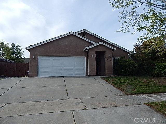 615 Vallecito Way, Red Bluff, CA 96080 - single story home featuring driveway, stucco siding, an attached garage, and fence