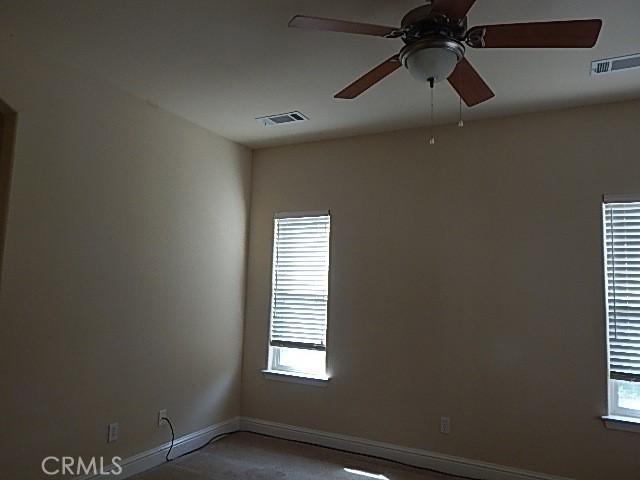 615 Vallecito Way, Red Bluff, CA 96080 - empty room featuring baseboards and ceiling fan