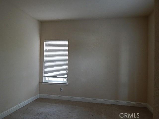 615 Vallecito Way, Red Bluff, CA 96080 - empty room with light carpet and baseboards