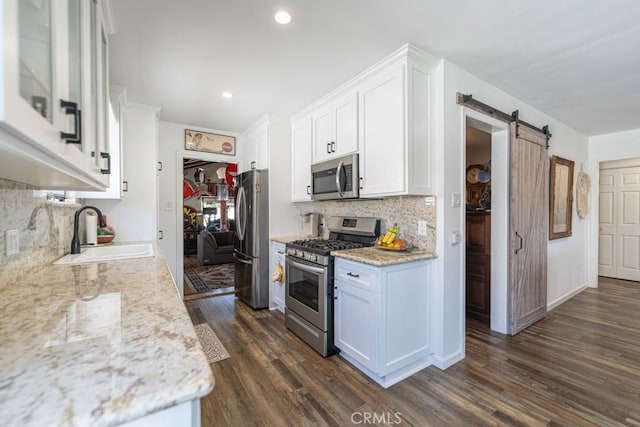 3717 W 182nd St, Torrance, CA 90504 - kitchen with appliances with stainless steel finishes, white cabinetry, decorative backsplash, dark wood-style floors, and recessed lighting