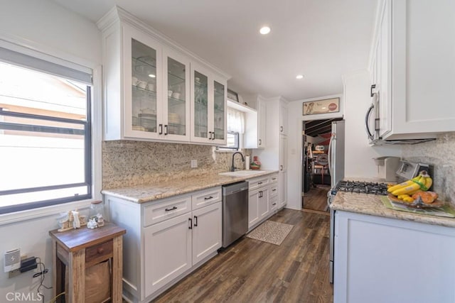 3717 W 182nd St, Torrance, CA 90504 - kitchen with stainless steel appliances, white cabinets, tasteful backsplash, and recessed lighting