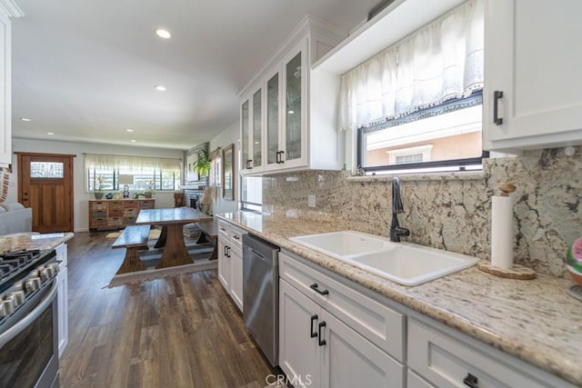 3717 W 182nd St, Torrance, CA 90504 - kitchen featuring appliances with stainless steel finishes, dark wood-style flooring, white cabinetry, glass insert cabinets, and recessed lighting