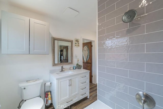 3717 W 182nd St, Torrance, CA 90504 - bathroom featuring tiled shower, vanity, and wood finished floors