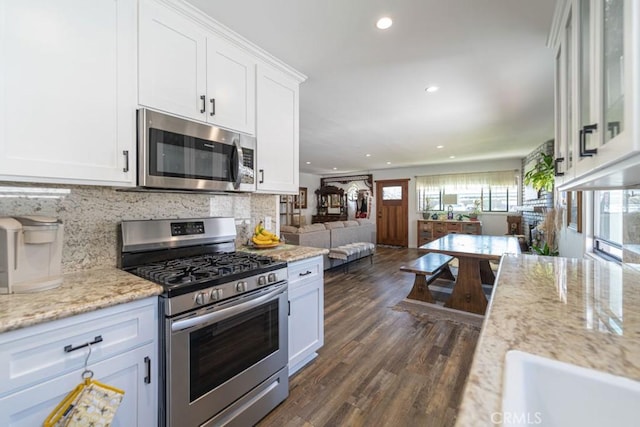 3717 W 182nd St, Torrance, CA 90504 - kitchen featuring appliances with stainless steel finishes, white cabinetry, recessed lighting, backsplash, and dark wood-style floors