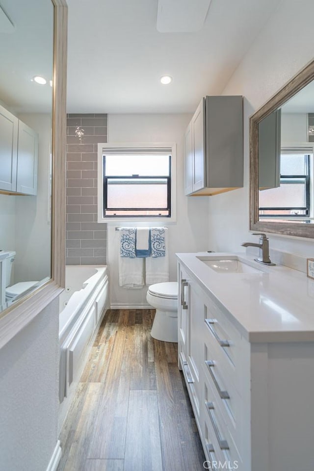 3717 W 182nd St, Torrance, CA 90504 - bathroom with vanity, hardwood / wood-style flooring, shower / washtub combination, and recessed lighting