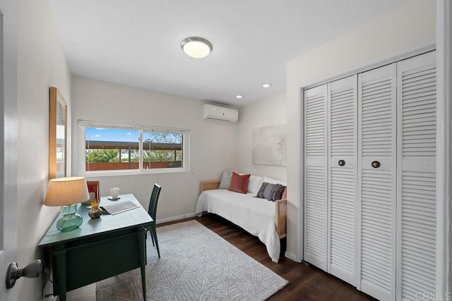 5426 Dwight St, San Diego, CA 92105 - bedroom with a wall unit AC, dark wood-type flooring, a closet, and recessed lighting