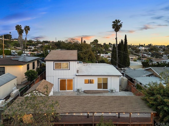 5426 Dwight St, San Diego, CA 92105 - back of property at dusk featuring a fenced backyard and board and batten siding