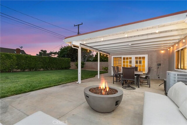 view of patio with an outdoor fire pit and outdoor dining space