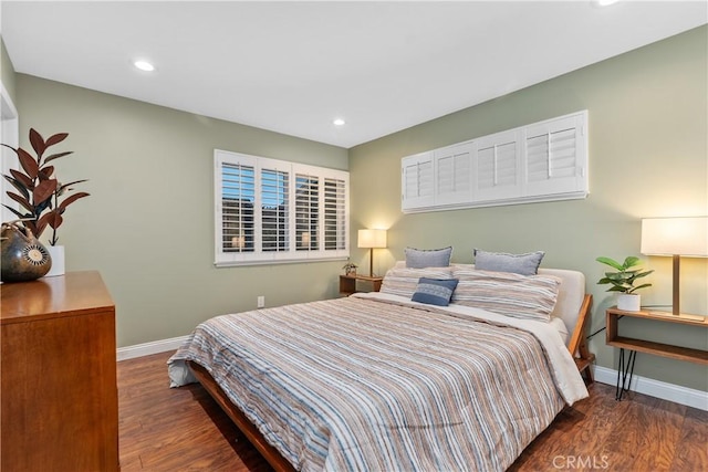 bedroom with baseboards, wood finished floors, and recessed lighting