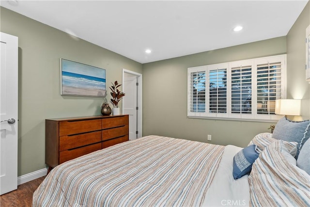 bedroom with wood finished floors, recessed lighting, and baseboards