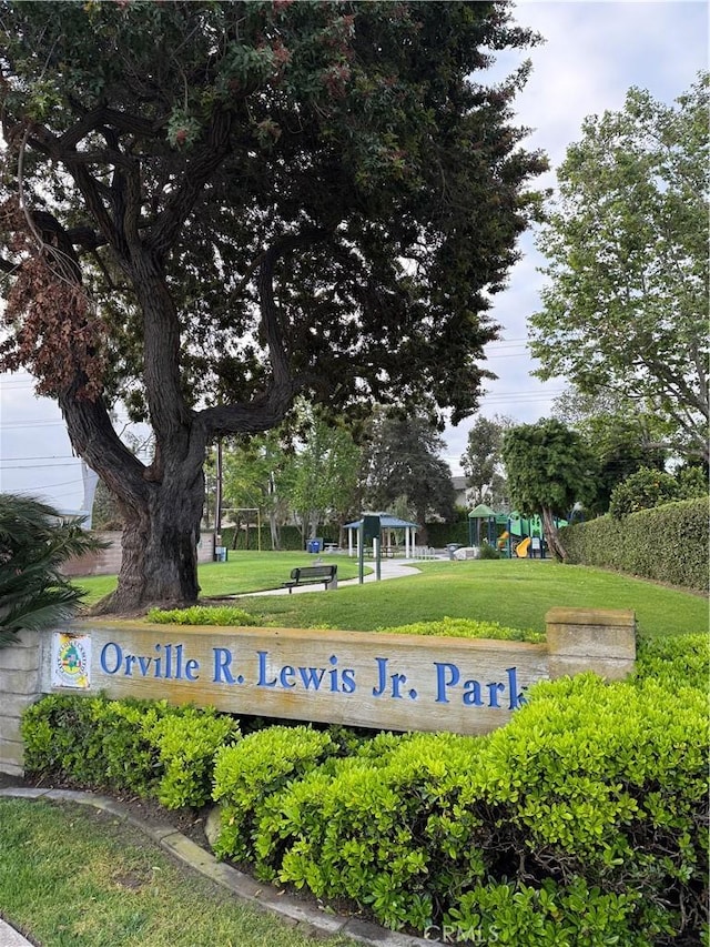view of home's community with a lawn