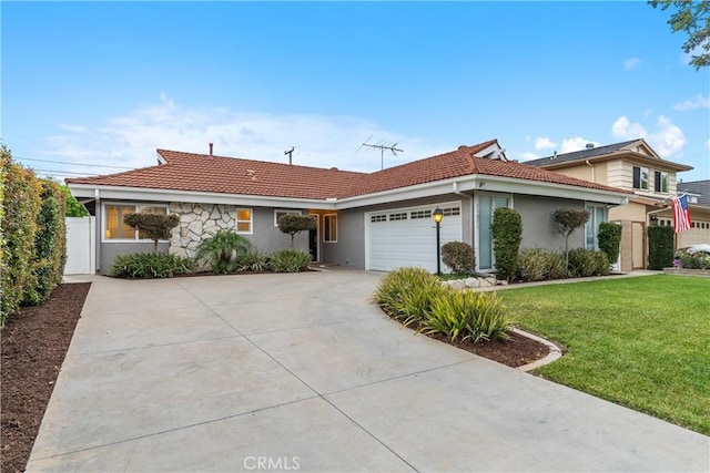 single story home featuring stucco siding, a tiled roof, driveway, and a garage