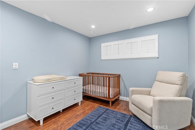 bedroom featuring dark wood-style floors, baseboards, and recessed lighting