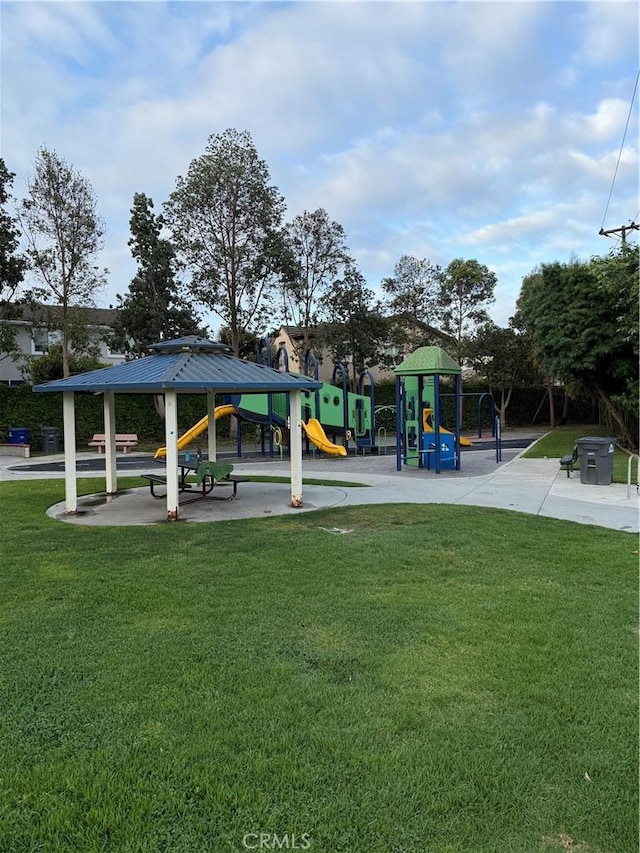 view of property's community with a lawn