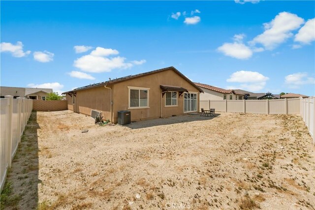 37732 Phelan Ln, Palmdale, CA 93552 - back of property with a fenced backyard, stucco siding, and central AC unit