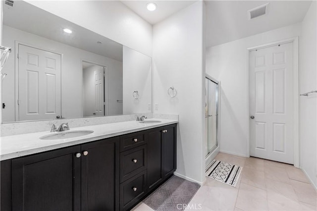 37732 Phelan Ln, Palmdale, CA 93552 - full bath featuring a stall shower, baseboards, double vanity, recessed lighting, and tile patterned flooring