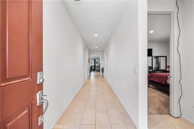37732 Phelan Ln, Palmdale, CA 93552 - corridor with recessed lighting, light tile patterned floors, and baseboards