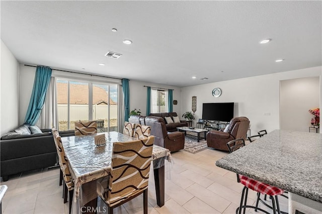 37732 Phelan Ln, Palmdale, CA 93552 - dining room with recessed lighting and light tile patterned floors