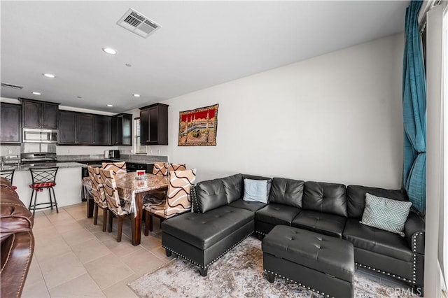 37732 Phelan Ln, Palmdale, CA 93552 - living room featuring light tile patterned floors and recessed lighting